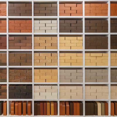 Shelves with bricks of various colors. Brick wall